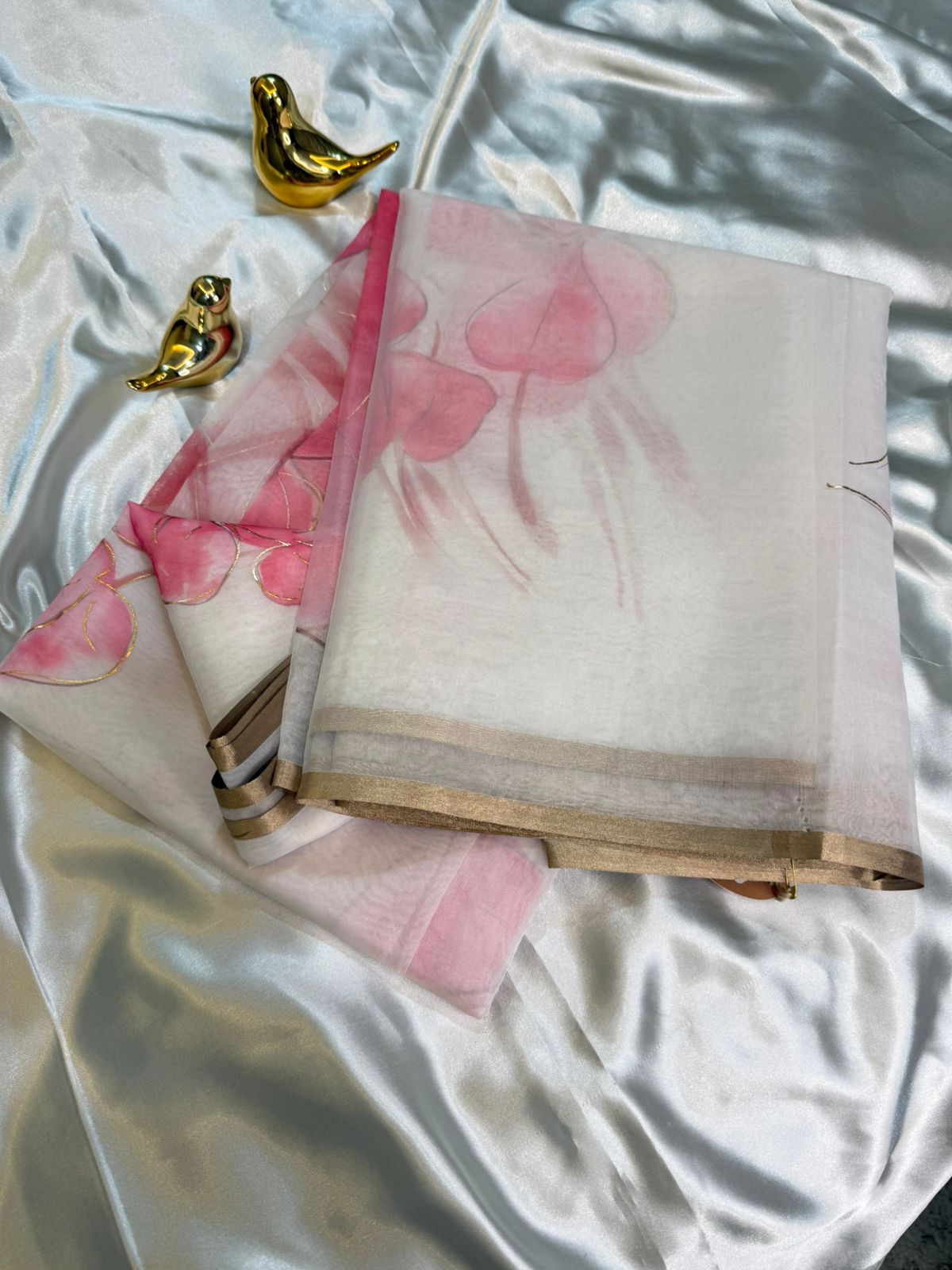 White Organza Saree with Pink Floral Motifs and Gold Border
