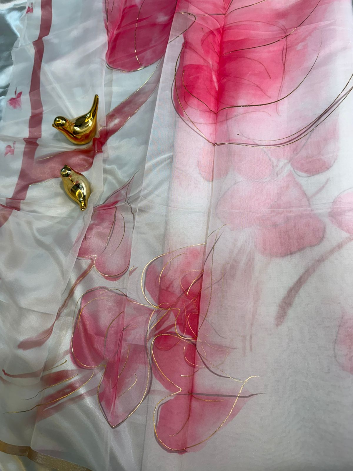 White Organza Saree with Pink Floral Motifs and Gold Border